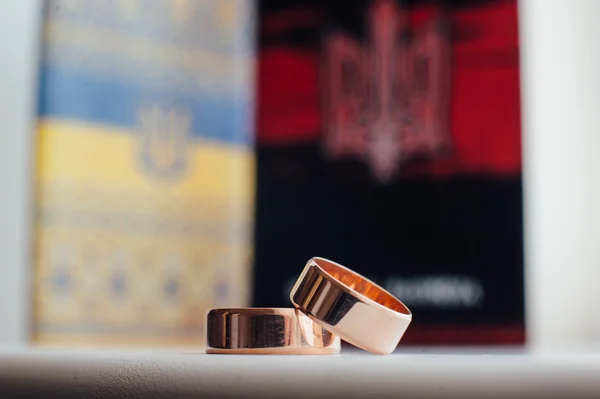Wedding rings on a background of symbol Ukraine