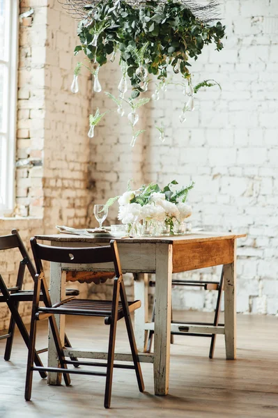 Wedding room decorated loft style with a table and accessories