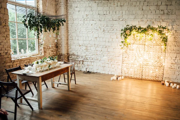 Wedding room decorated loft style with a table and accessories