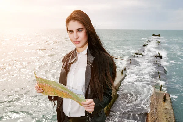 Woman on the pier watching map