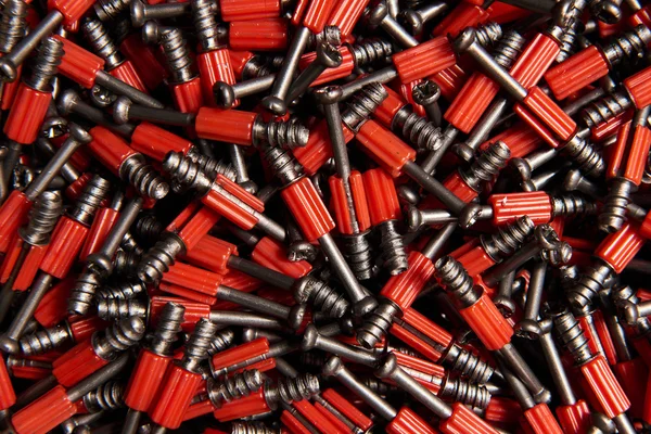 Many furniture red screws as background