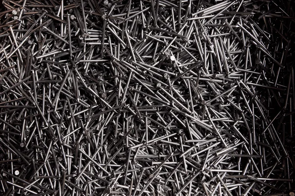 Full frame background showing lots of metallic nails