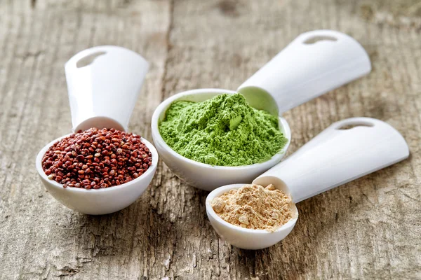 Barley or wheat grass powder, red quinoa and maca powder