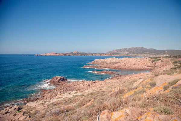 Seaside in the summer. Bright sun. Peaceful landscape. Sardinia.