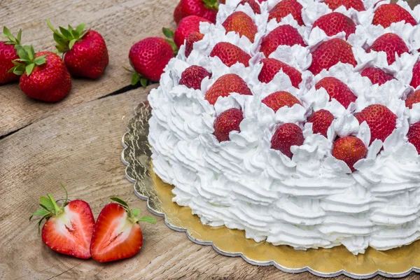 Light, delicate and tasty cream cake with fresh strawberries (half cake)