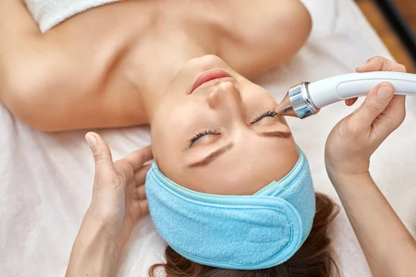 Ultrasonic face cleaning, peeling, in a beauty salon