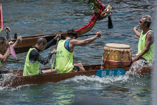 ABERDEEN,HONGKONG,JUNE 6 2016: Boats racing in the Love River for the Dragon Boat Festival in Aberdeen Hongkong