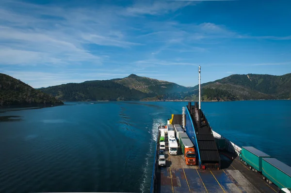 Ferry loaded with trucks and cars traveling from Wellington to Picton via Marlborough Sounds, New Zealand