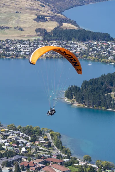 Queenstown, New Zealand - March 2016: Tandem paragliding over Lake Wakatipu in Queenstown, New Zealand