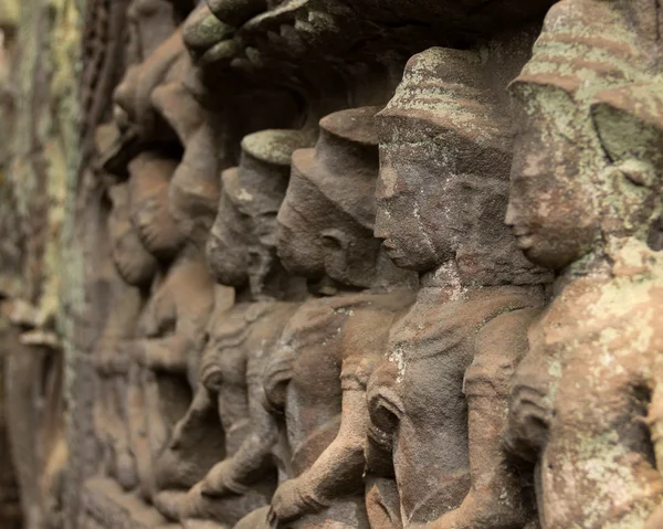 Bas-Relief at Ta Phrom temple showing a row of stone soldiers