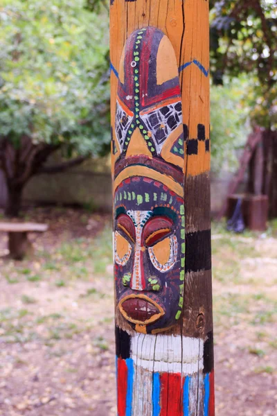 North American totem mask on the totem pole