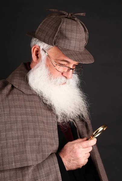 Bearded detective investigate with magnifying glass