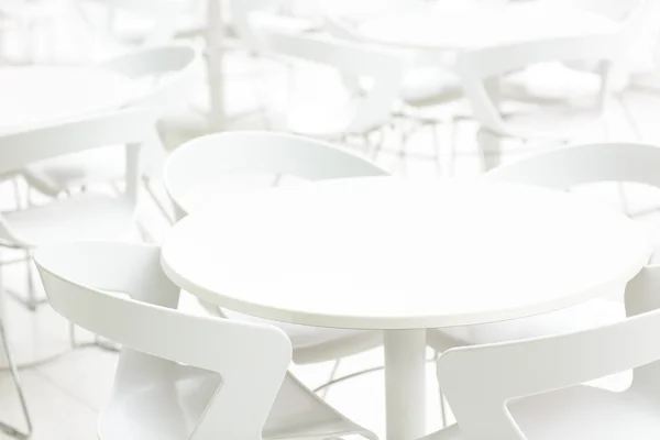 Empty white interior of tables and chairs. Infinity perspective. Cafe, clinic background.