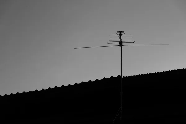 Home TV antennas on black and white tone.