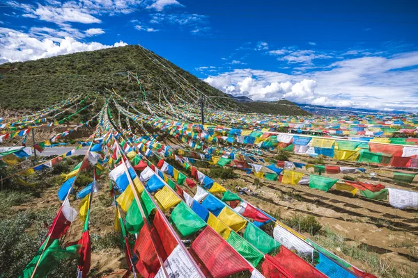 Buddhist prayer flags over the road