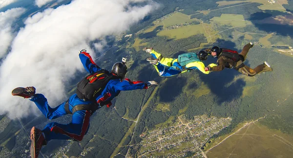 Flying operator shoots skydivers in the air