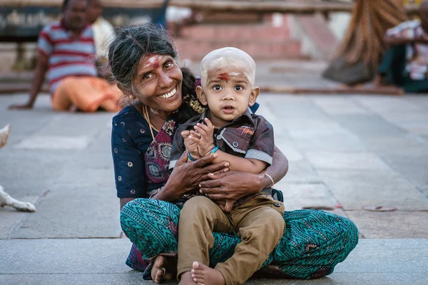Mother and her son in indian temple