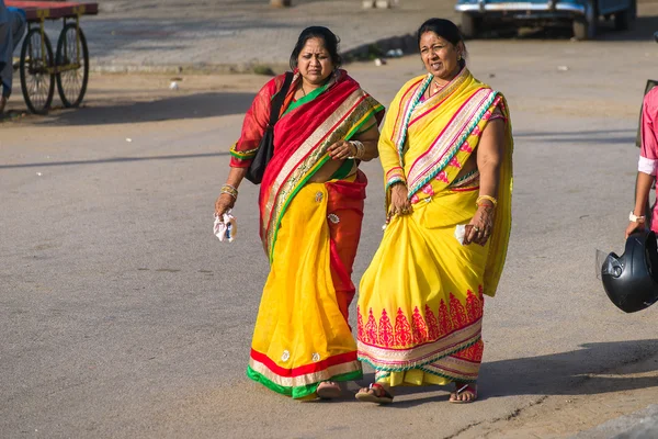 Indian women in colored sari on the street