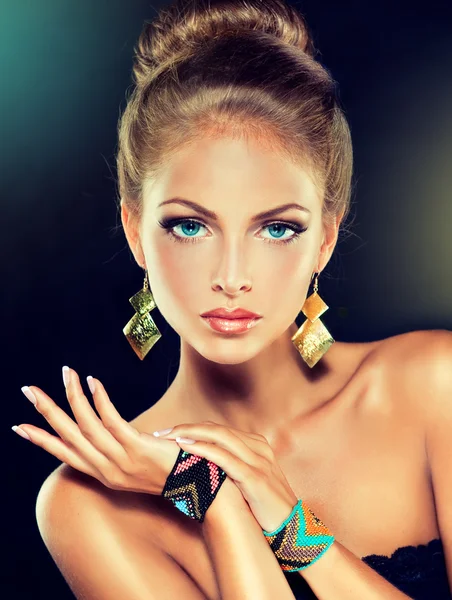 Blond female model with  jewellery accessories