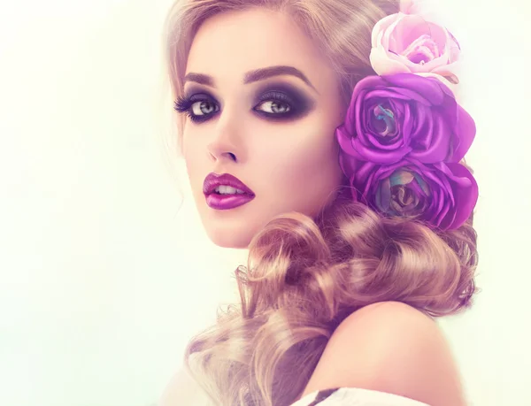 Woman with curly hair and flowers