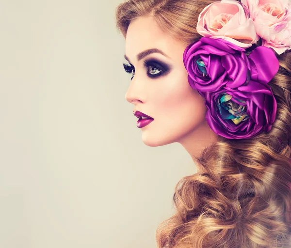 Woman with curly hair and flowers