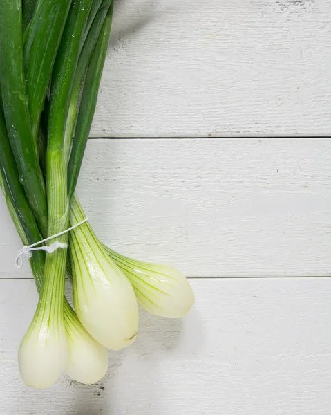 Spring Onions on table