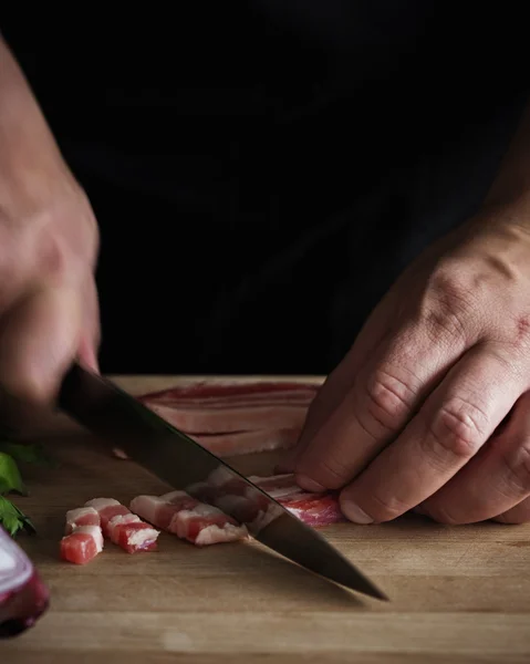 Chef Cutting Bacon