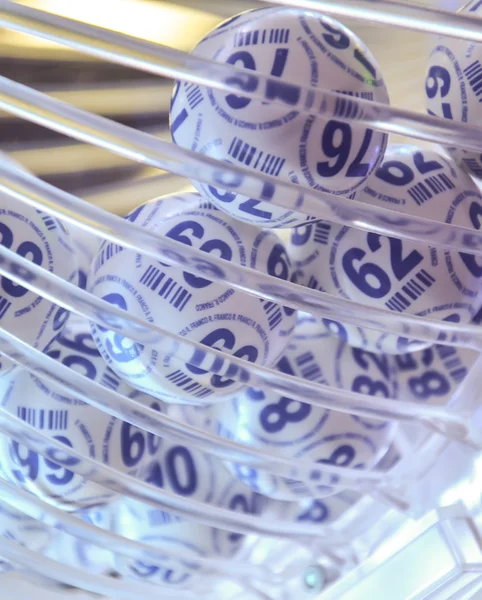 Bingo balls in the lottery drum. Glass drum. Bingo drawing machine.