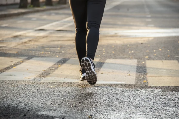 A close up of a runners shoes