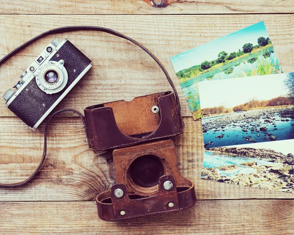Very old film camera and old foto.