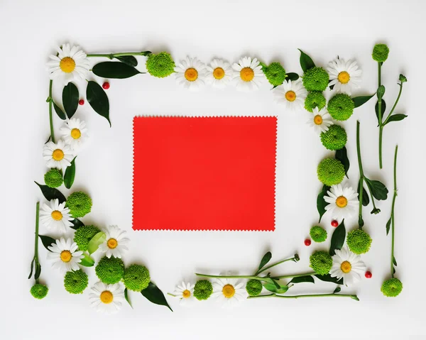 Red paper with wreath frame from flowers,