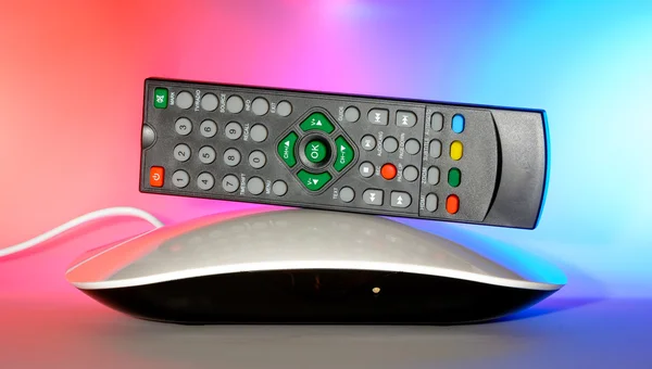 Set top box to receive digital television DVB-T and DVB-T2 digital radios. Black-white finish on a colored background and the temonte control