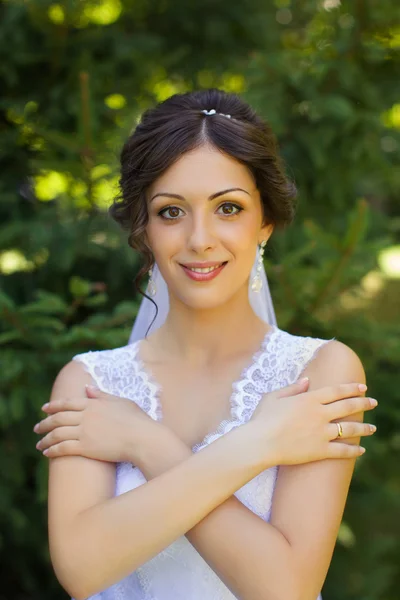 Bride with beautiful eyes at a wedding a walk in the woods