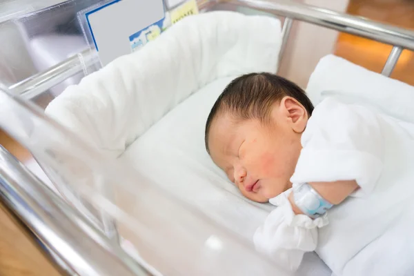 Asian newborn baby in hospital, delivery room