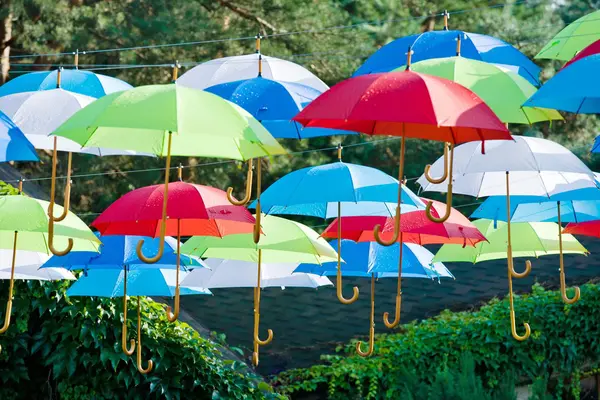 Street decoration, lots of colorful umbrellas in the air