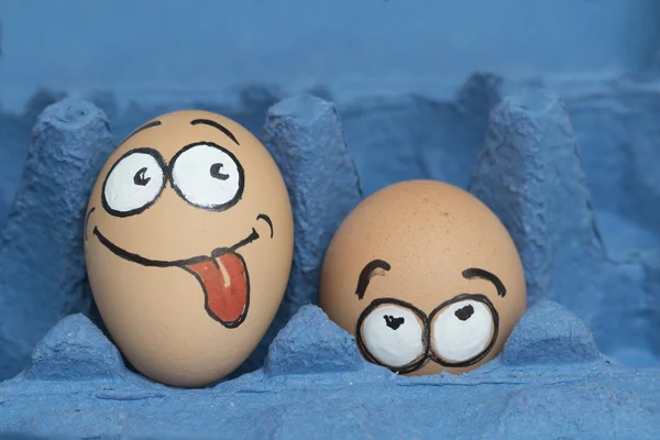 Two eggs face happy and  frightened