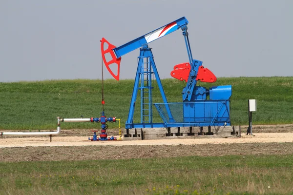 Blue and red oil well