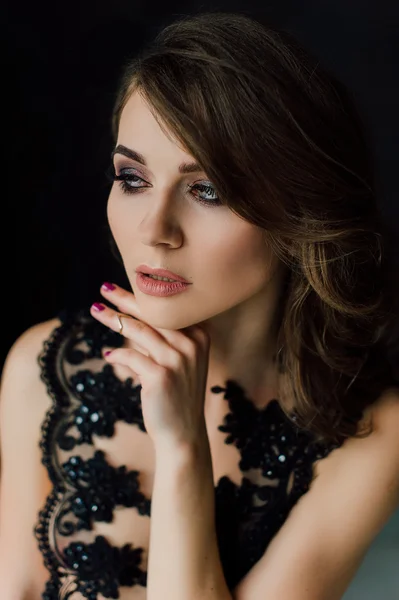 Close up. Individuality. Thoughtful Elegant Lady in Black Prom Evening Dress. Studio retouched photo.