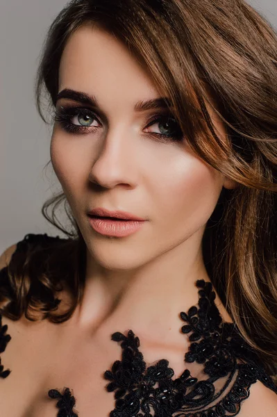 Close up. Individuality. Thoughtful Elegant Lady in Black Prom Evening Dress. Studio retouched photo.