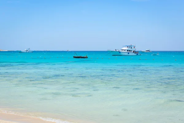 Beautiful sea landscape - beach, sea, sky, yachts, ships