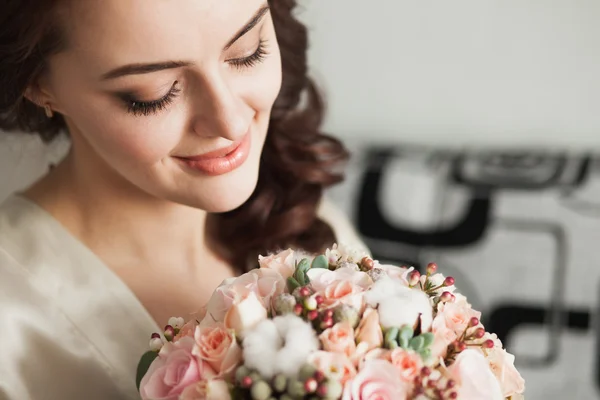 Beautiful young lady with soft make up and flowers