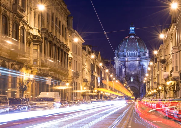 Brussels (Bruxelles), Belgium - February 2016: Nigh view of the Belgian Capital, car light trails on Rue Royal street, view on Saint Mary\'s Royal Church