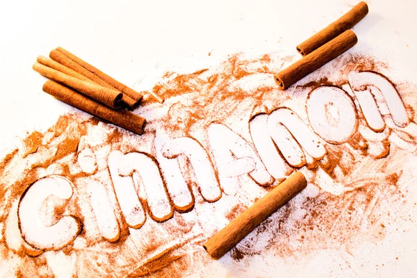 Cinnamon sticks on a white table