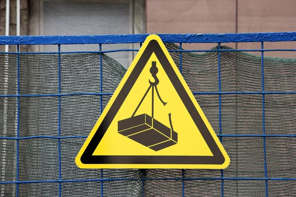 Traffic construction yellow triangular sign warning about fallin