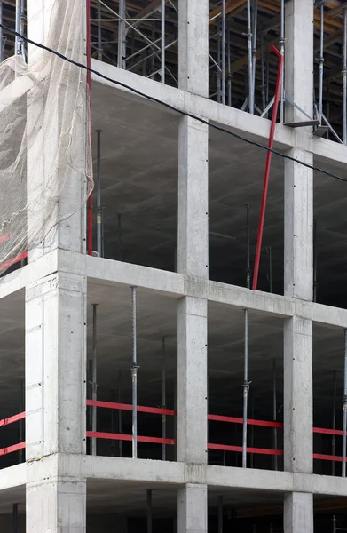 Concrete building under construction with monolithic reinforced