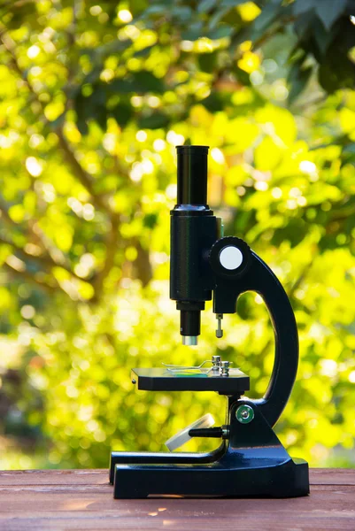 School microscope. Device for the study of biology. The study of nature and the environment.