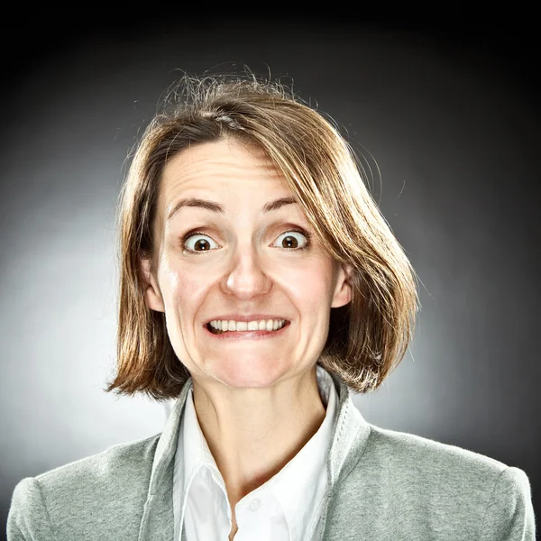 Funny woman expression portrait on grey background