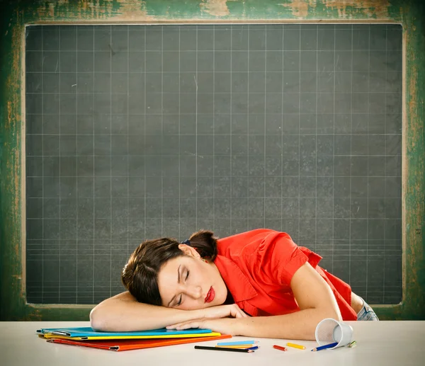 Asleep student red dressed with glasses and blackboard