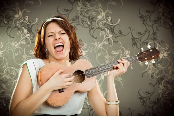 Vintage woman plays ukulele and sing on tapestry background