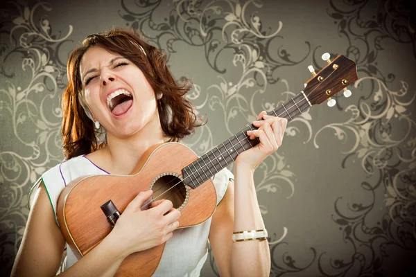 Vintage woman plays ukulele and sing on tapestry background